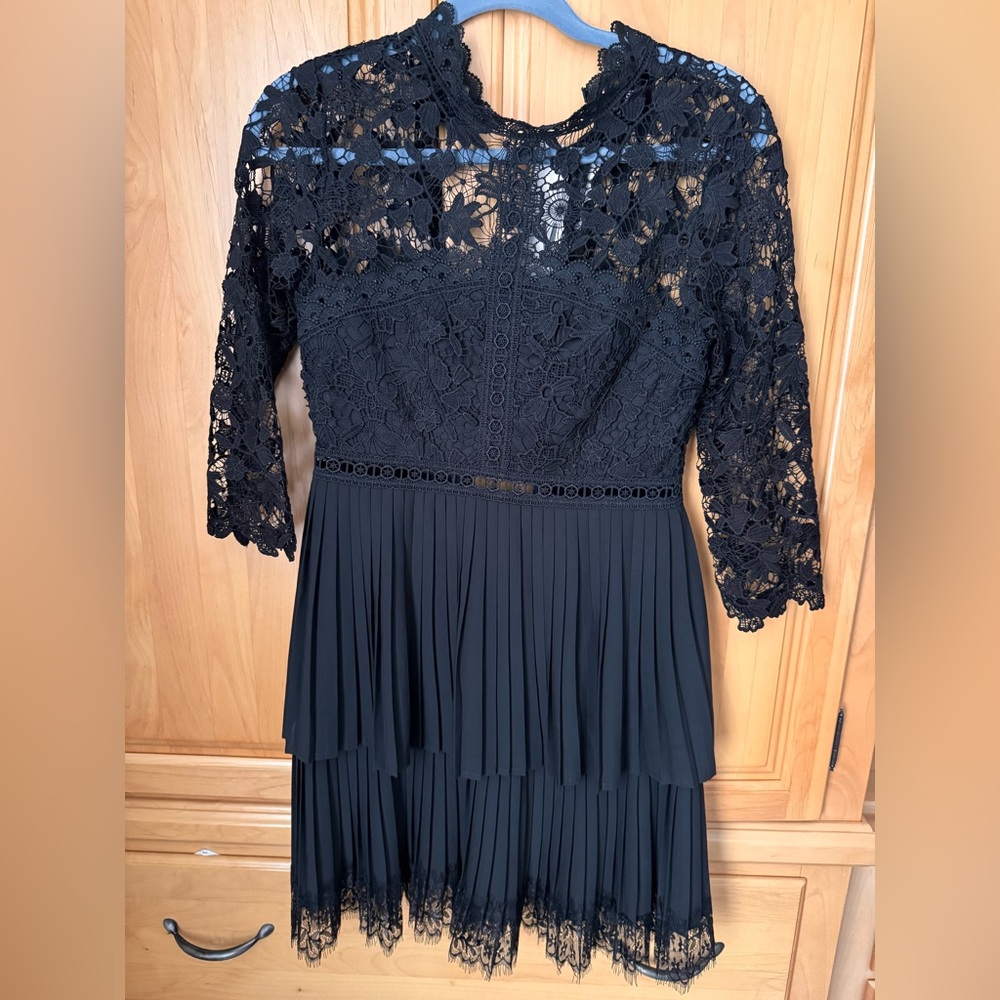 Zara black lace dress. New with tag. Zipper back. Super beautiful! Size XS